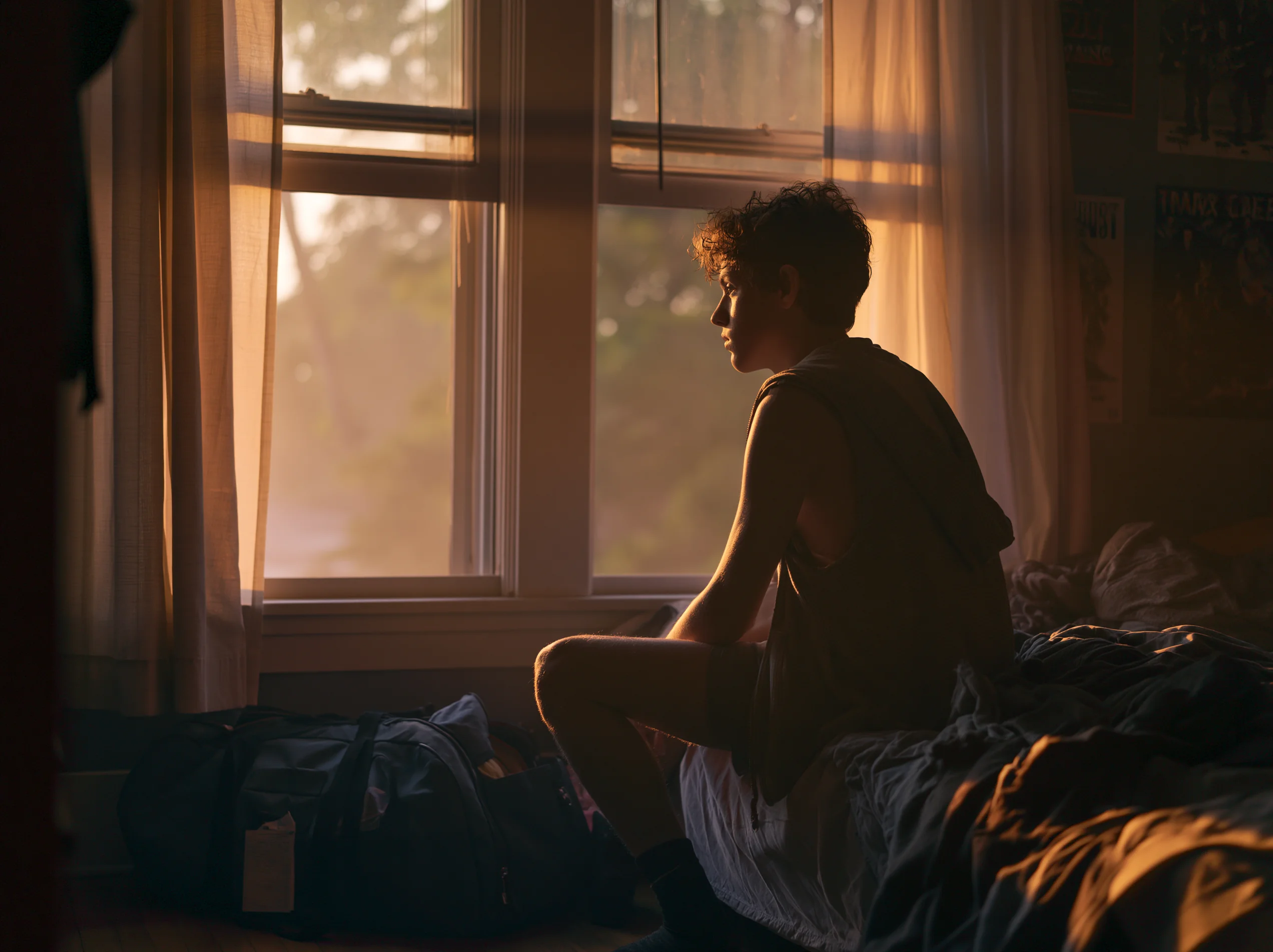 Son doesn't want to go back to boarding school: a teenage boy at home in late July facing the re-enrollment decision.